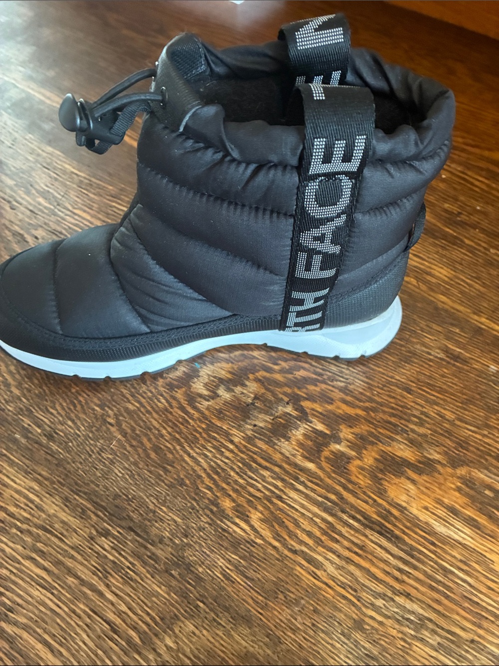 The North Face Kids Black Puffer Snow Boot with Light Gray Sole